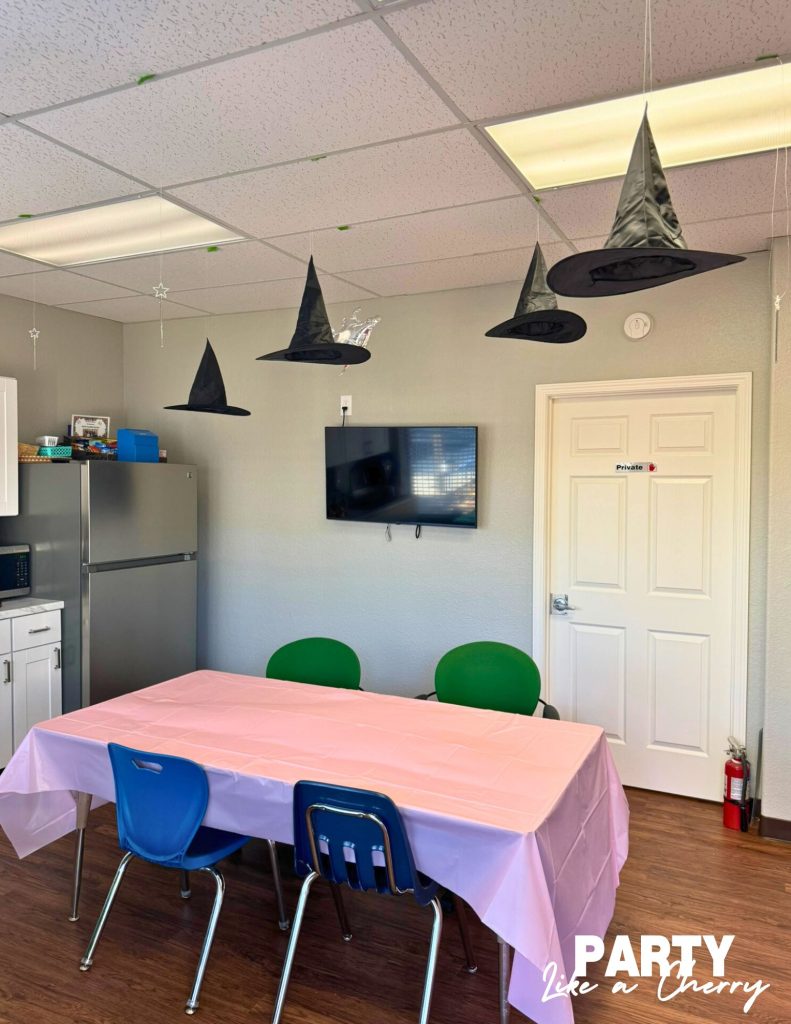 hang hats and wands from the ceiling with fishing line for a wicked party 
